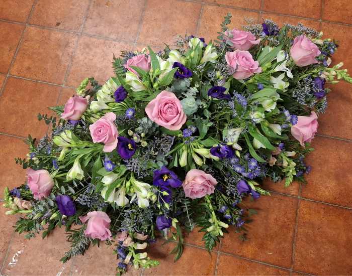 Pink, Blue and White Double Ended Funeral Spray.