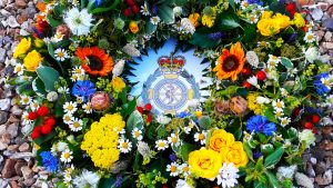 This is a beautiful wreath in summer shades a countryfied look with many different types of flowers like mini Sunflowers, Nigella, Cornflowers, red Hypericum, yellow Spray Roses, Tanacetum, Alchemilla mollis Sedum and mixed foliage's