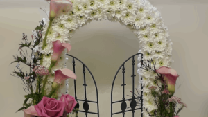 A Gates of Heaven funeral tribute is a stunning and meaningful floral arrangement that symbolizes the passage of a loved one into eternal rest. Designed to reflect the grandeur of a heavenly entrance, this tribute brings comfort and solace to grieving families while celebrating the life of the departed. The Meaning Behind the Gates of Heaven Tribute This elegant arrangement typically features a pair of floral-adorned gates, often accompanied by angelic accents or cascading flowers. It represents a peaceful transition, offering reassurance that the loved one is welcomed into a place of eternal serenity.
